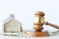 Property auction, Gavel wooden and model house on white background, lawyer of home real estate and ownership property concept