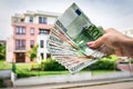 Property buyer holding euro banknotes - real estate concept Royalty Free Stock Photo