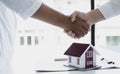 Property manager Shake hands with congratulations on the customers who bought the house with insurance, Hand shake