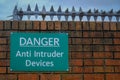 Property protection with sign. Danger Anti Intruder Devices Royalty Free Stock Photo