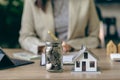 Property tax and market growth coins with stacks of coins on wooden table to show savings. Family plan. House. Loan Royalty Free Stock Photo