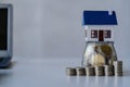 Property tax and market growth coins with stacks of coins on wooden table to show savings. Family plan. House. Loan Royalty Free Stock Photo