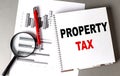 PROPERTY TAX text written on notebook with chart Royalty Free Stock Photo