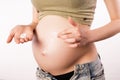 Prophylaxis of stretches on pregnant woman skin Royalty Free Stock Photo