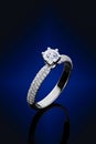 Proposal diamonds ring on blue background Royalty Free Stock Photo