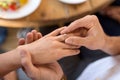 Man giving diamond ring to woman at restaurant Royalty Free Stock Photo