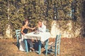 Proposal and marriage concept. Couple in love at outdoor cafe. Man kiss hand of girl in restaurant. Love relations of Royalty Free Stock Photo