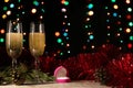Proposal to get married on New Year`s or Christmas night. Dinner of a couple with two glasses of champagne and a wedding ring.
