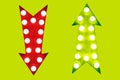 Pros and cons red down and green up vintage retro arrows illuminated with light bulbs on green background