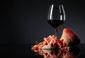 Prosciutto with ciabatta, red wine and thyme on a black background Royalty Free Stock Photo