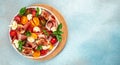 Prosciutto di Parma salad with figs and mozzarella, fresh basil leaves, tomato, Long banner format. top view