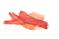 Prosciutto ham slice isolated on white Royalty Free Stock Photo