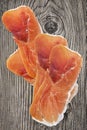 Prosciutto Smoked Pork Ham Slices Set On Old Wooden Knotted Cracked Garden Table Grunge Surface