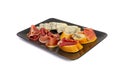 Prosciutto Tapas and Mold Cheese on Black Plate, Spanish Jamon Slices, Parma Ham, Sliced Serrano, Iberico Royalty Free Stock Photo