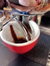 A proses to make an espresso with Red Cup