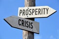 Prosperity and crisis - wooden signpost Royalty Free Stock Photo