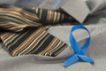 Prostate cancer awareness concept with light blue ribbon on necktie Royalty Free Stock Photo