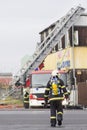 Prostejov Czech Rep 28th January - Firefighter ladder car next to a prefabricated house damaged by fire. Real situation