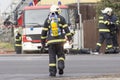 Prostejov Czech Rep 28th January - Fireman walking towards a a firetruck during real fire fighting action