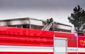 Prostejov Czech Rep 28th January - Firemen on a ladder by a roof fighting with fire in prefabricated house