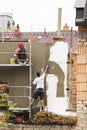 Prostejov Czech Rep. 25th June Two workers on scaffold renovating facade on a town house. Royalty Free Stock Photo