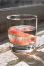 Prosthesis in a glass with a solution. Dental prosthesis care. Full removable plastic denture of the jaws. Two acrylic dentures. Royalty Free Stock Photo