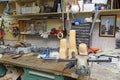 At the prosthesis workshop. Wooden blanks, tools and parts for manufacturing of artificial limbs placed on a work table
