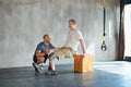 Prosthetic leg, fitness and people helping with workout, wellness and muscle health on support block. Man with Royalty Free Stock Photo