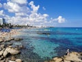 Protaras. Famagusta area. Cyprus. Large stones near the shore, clear water of the Mediterranean Sea, a view of the sandy large