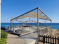 Protaras. Famagusta area. Cyprus. An observation deck on the shores of the Mediterranean Sea, where a group of people practice