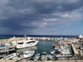 Protaras. Famagusta area. Cyprus. Pier, port with small ships, yachts and boats in the bay of the Mediterranean Sea against the