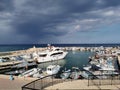 Protaras. Famagusta area. Cyprus. Pier, port with small ships, yachts and boats in the bay of the Mediterranean Sea against the