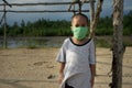 Protect children from the corona virus by using a surgical mask