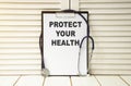 Protect your health concept. Physician shows a message on a signboard Royalty Free Stock Photo