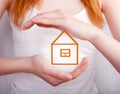 Protect your home -house shielded with hands Royalty Free Stock Photo