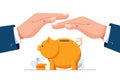 Protect your money concept. Businessman is holding hands over the piggy bank to protect savings. piggy bank, financial Royalty Free Stock Photo