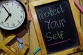 Protect yourself on phrase colorful handwritten on chalkboard