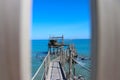 Ancient fishing machine called ` trabucco `. Typical of the Italian Adriatic sea. Used in Abruzzo, Molise and Gargano coast. Royalty Free Stock Photo