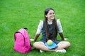 Protecting the health of your brain. Happy child relax on green grass. School break. Nutrition education. School snack Royalty Free Stock Photo