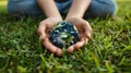 Protecting Our Planet: Hands Holding Earth on Green Grass Background for Environmental Concept Royalty Free Stock Photo