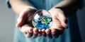 Protecting Our Planet: Sustainable Earth Preservation in Your Hands. Persons hands hold little Earth in shape of water drop Royalty Free Stock Photo