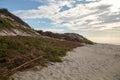 Protecting sand dunes from errosion. Coastal fortification Royalty Free Stock Photo