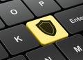Protection concept: Shield on computer keyboard background Royalty Free Stock Photo