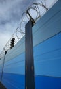 Protection fence with barbed wire for surface subway protection Royalty Free Stock Photo