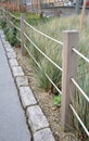 Protection of the flower bed from the entrance of dogs people bikes and other cars separates the flower bed ope fence wooden posts Royalty Free Stock Photo