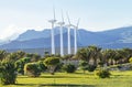 Protection of nature. Wind turbines against mountains landscape.