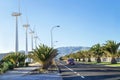 Protection of nature. Wind turbines against mountains and near road.