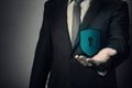 Businessman holding a shield. Royalty Free Stock Photo