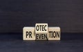 Protection and prevention symbol. Concept word Protection Prevention on wooden cubes. Beautiful black table black background. Royalty Free Stock Photo