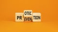 Protection and prevention symbol. Concept word Protection Prevention on wooden cubes. Beautiful orange table orange background. Royalty Free Stock Photo